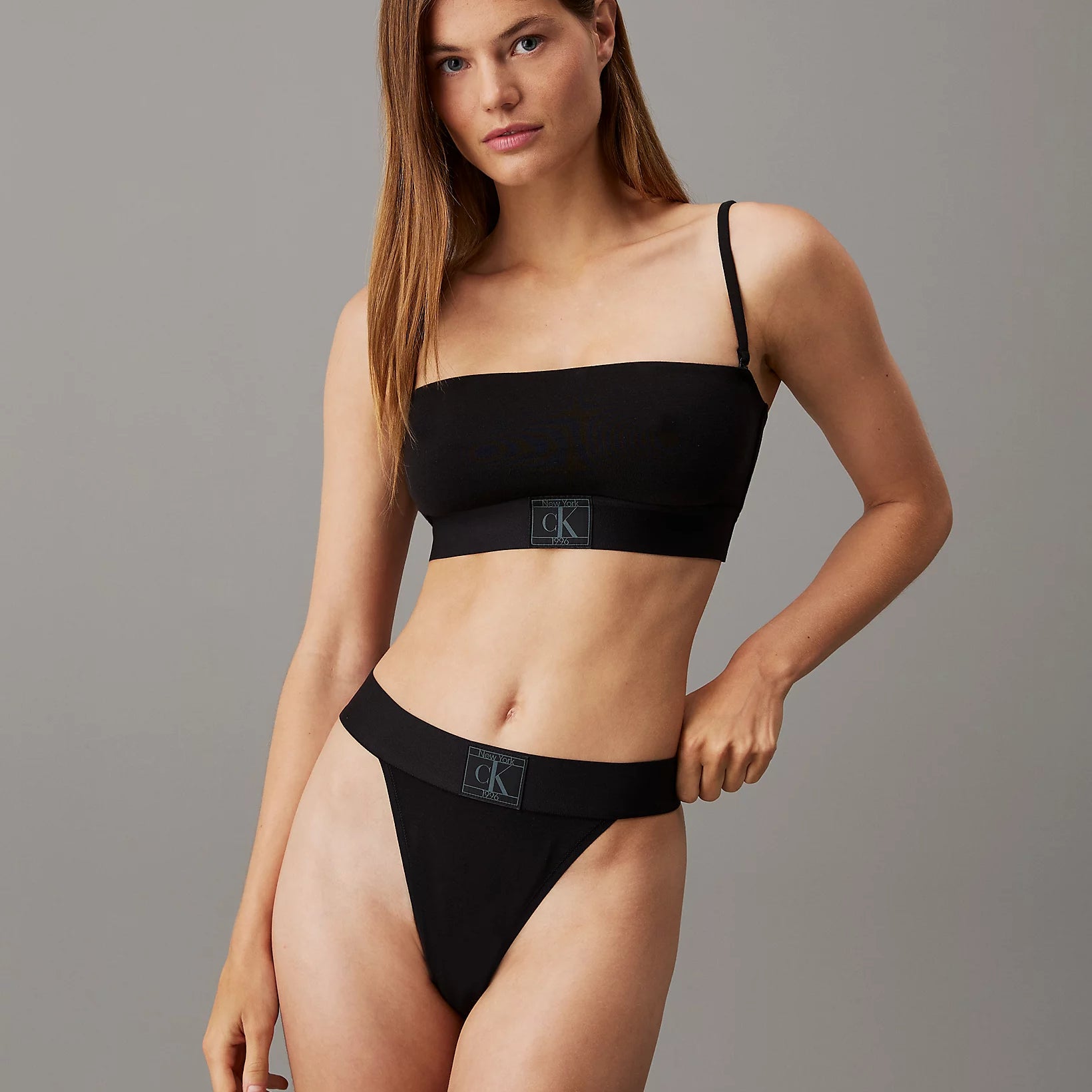 Calvin Klein CK ESTABLISHED Womens Unlined Bralette Black front view on model with matching black underwear.