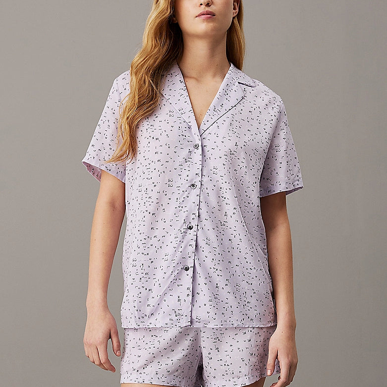 Calvin Klein WOVEN VISCOSE Pyjama Set Womens Scatter Logo Print/Lavender Blue front view featuring short sleeves and button details.