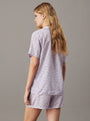 Calvin Klein WOVEN VISCOSE Pyjama Set Womens Scatter Logo Print/Lavender Blue rear view showcasing short sleeves and elasticated waist.