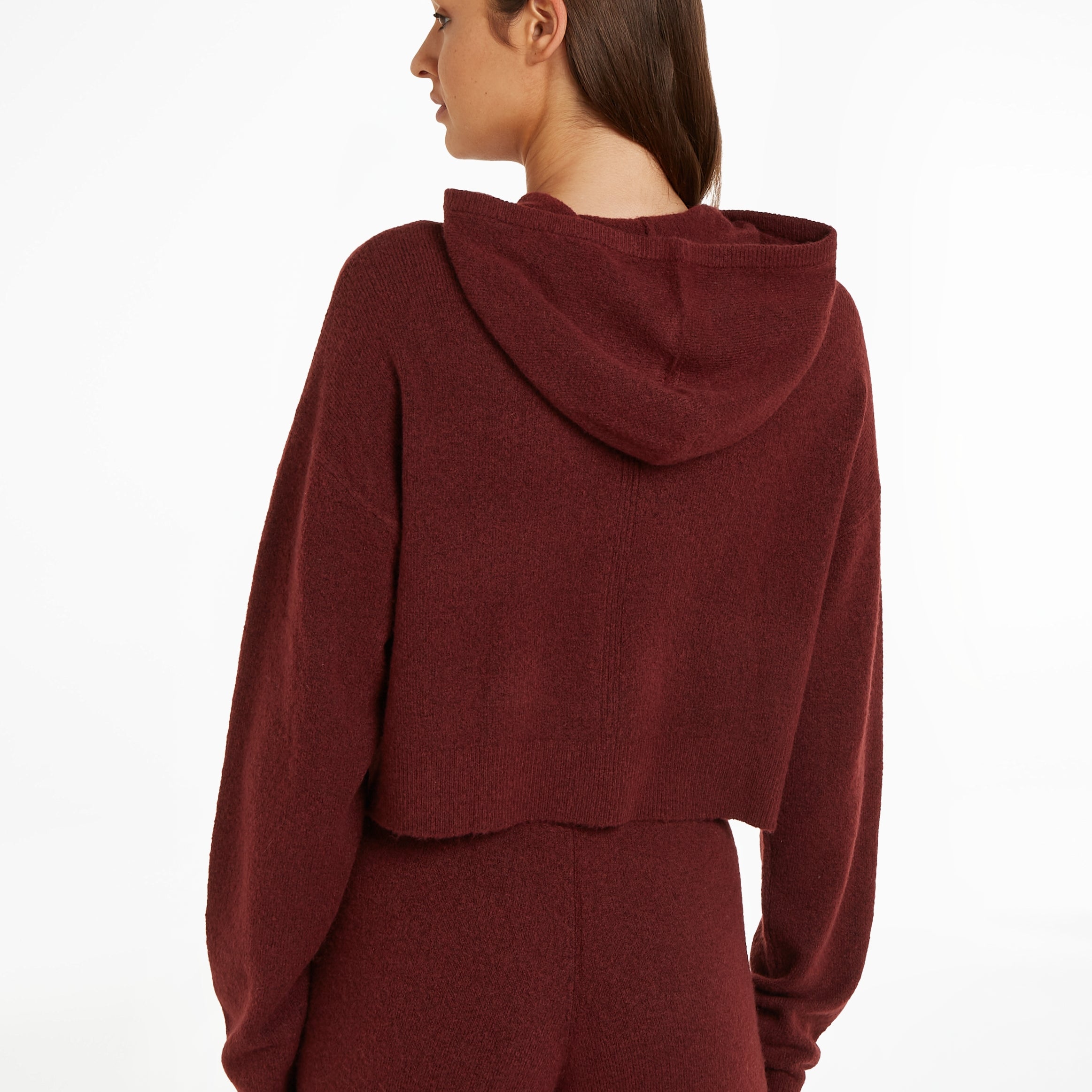 Calvin Klein Womens Hooded Sweater Tawny Port Red back view showcasing the cropped design and hood detail.