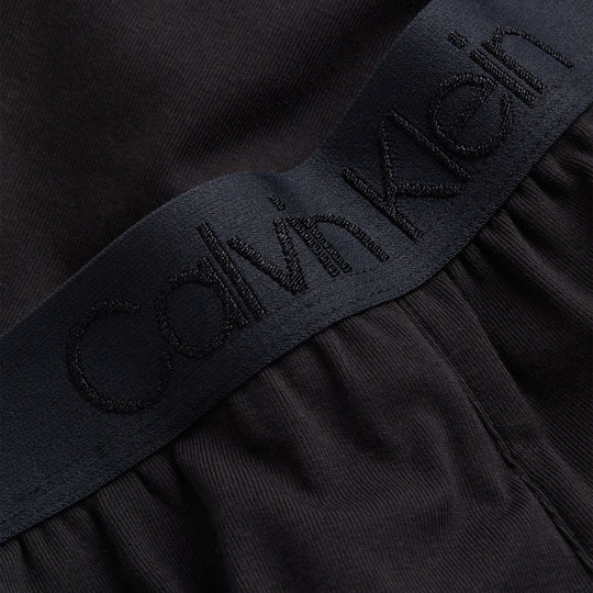 Calvin Klein INTRINSIC Womens Joggers Black detail view of waistband with logo embroidery.