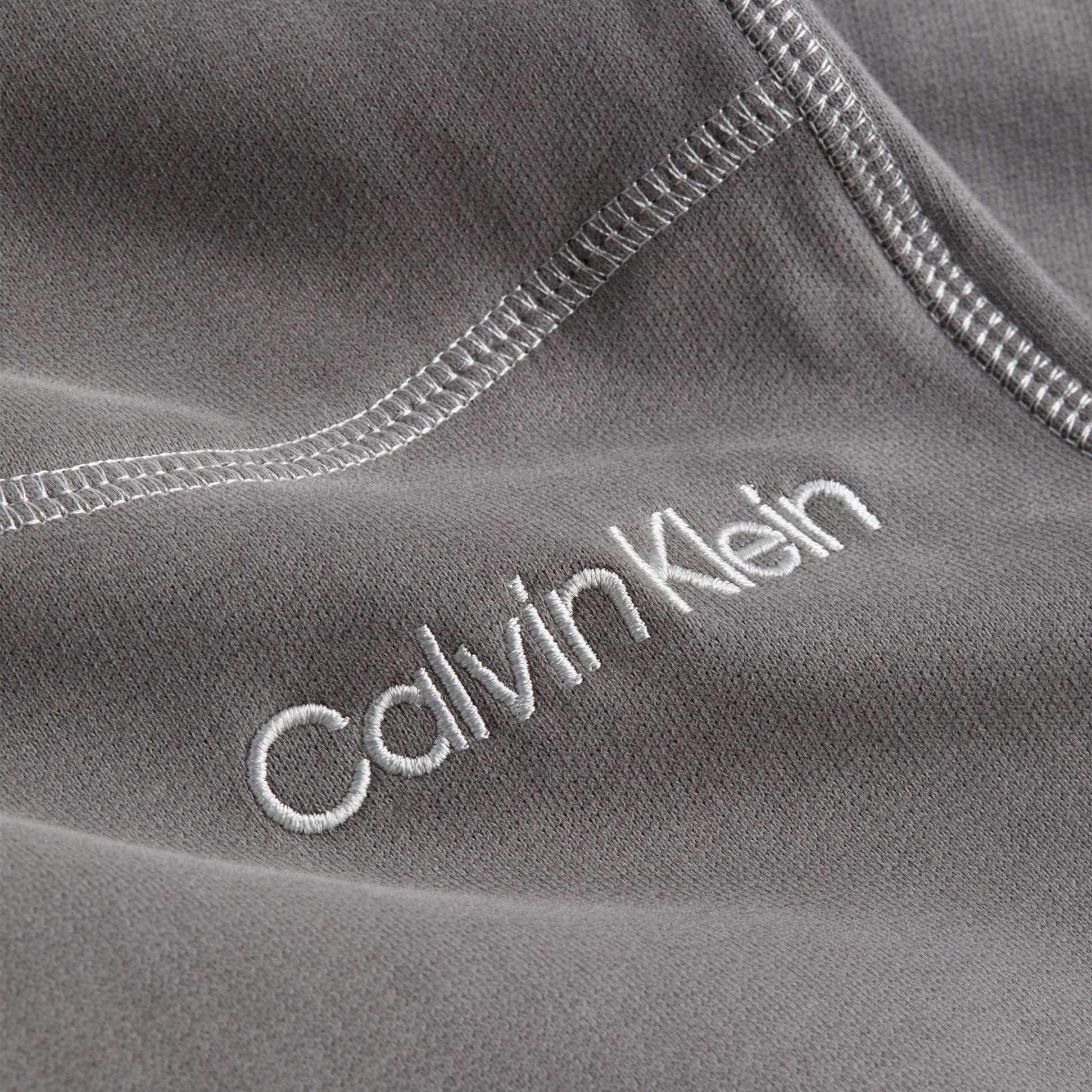 Calvin Klein JOGGER PA7 Womens Joggers Charcoal Gray detail view of fabric and logo stitching.