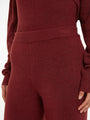 Calvin Klein Womens Pants Tawny Port Red detail view showcasing fabric texture and waistband design.
