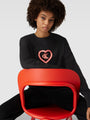 Calvin Klein CK96 Womens Lounge Sweatshirt Black front view on model with CK logo in heart design, stylish and relaxed fit.