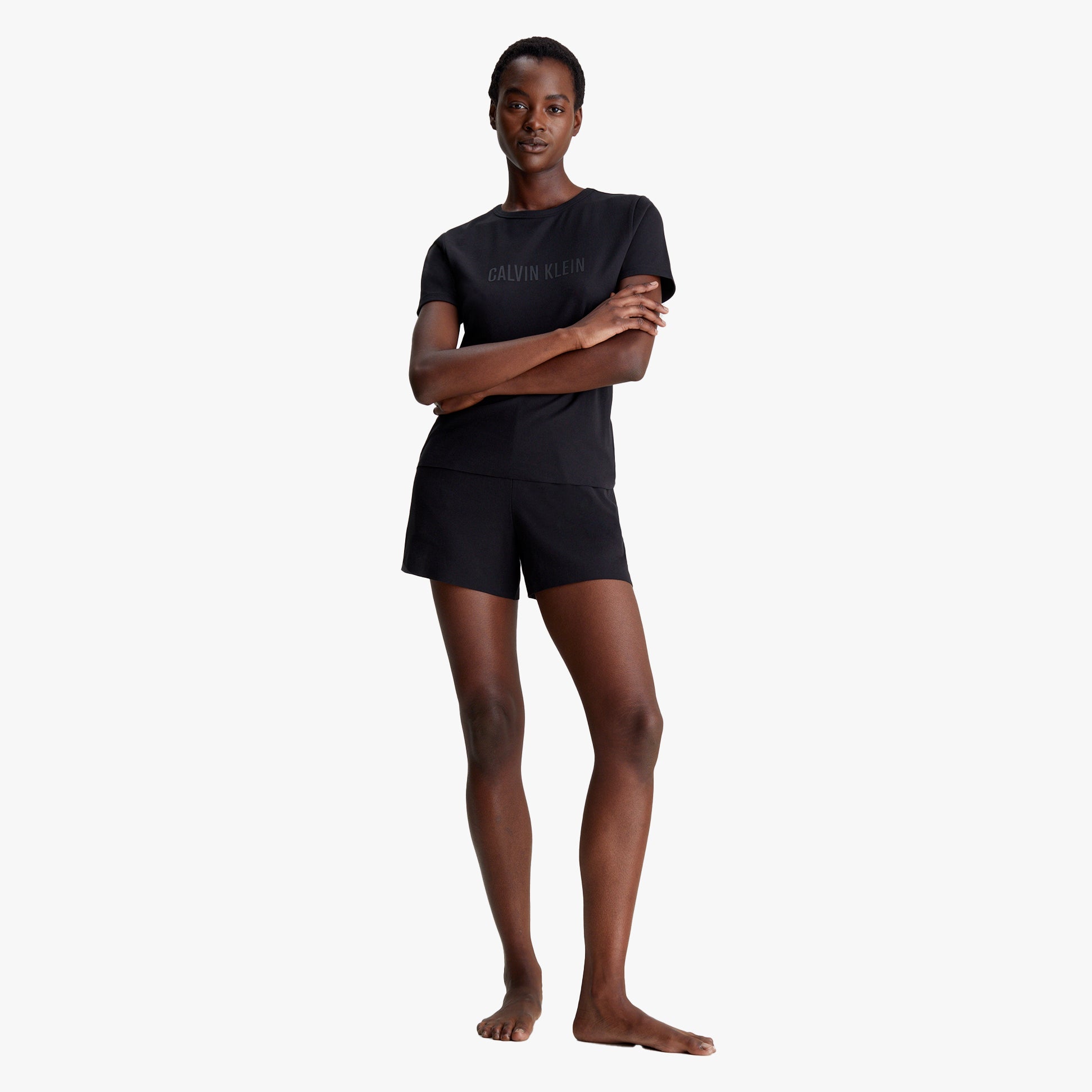 Calvin Klein INTENSE POWER Womens Short Pyjama Set Black front view on model wearing short sleeves and shorts.