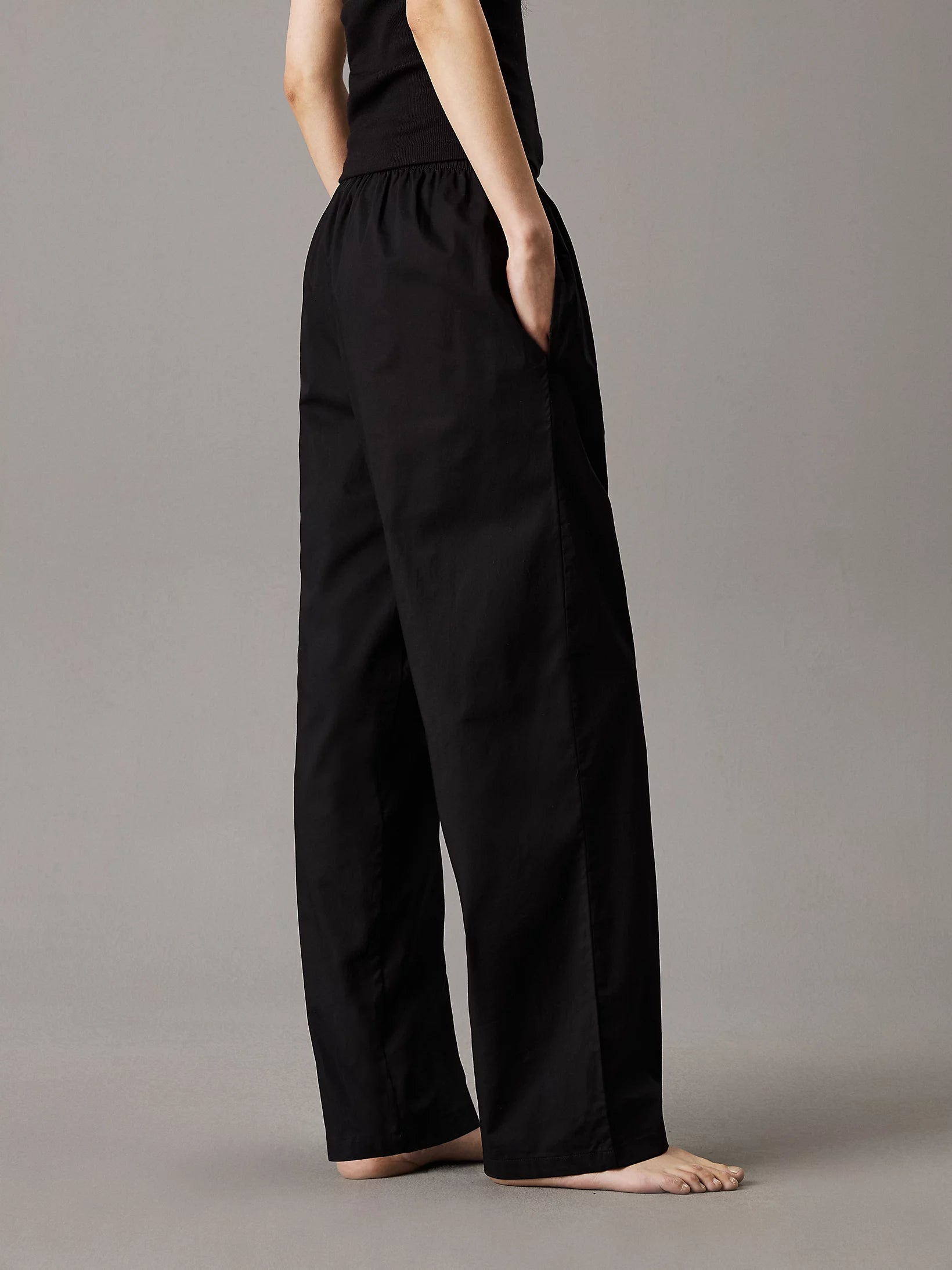 Calvin Klein CK ESTABLISHED Womens Pyjama Pants Black side view showcasing relaxed fit and pockets.