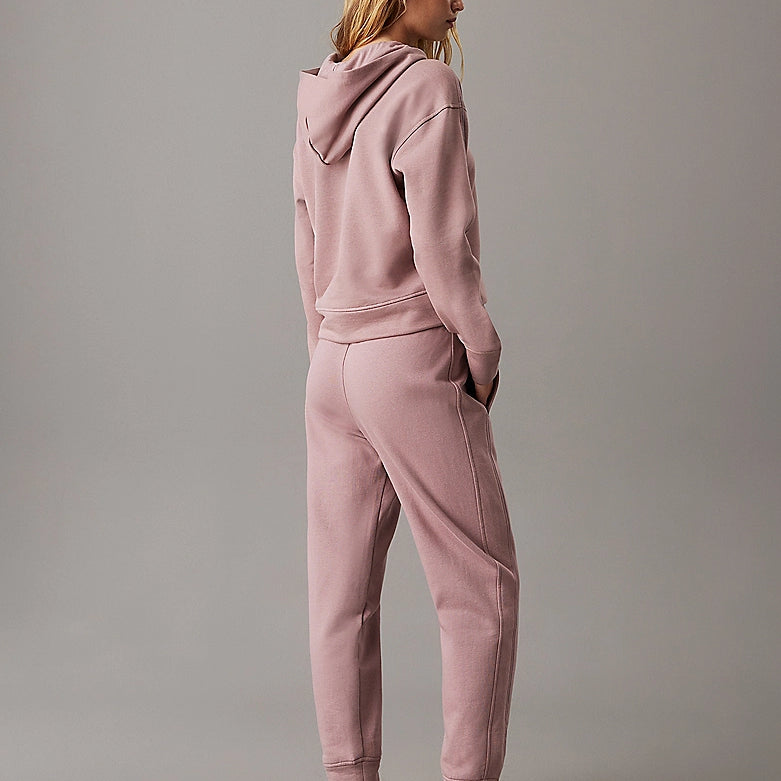 Calvin Klein TONAL LOGO LOUNGE Womens Hoodie Sand Trap, back view model wearing comfortable hoodie in sand trap color.
