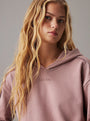 Calvin Klein TONAL LOGO LOUNGE Womens Hoodie Sand Trap front view with model, showing soft fabric and hood design.