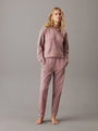 Calvin Klein TONAL LOGO LOUNGE Womens Hoodie Sand Trap front view on model, showcasing cozy design and comfortable fit.