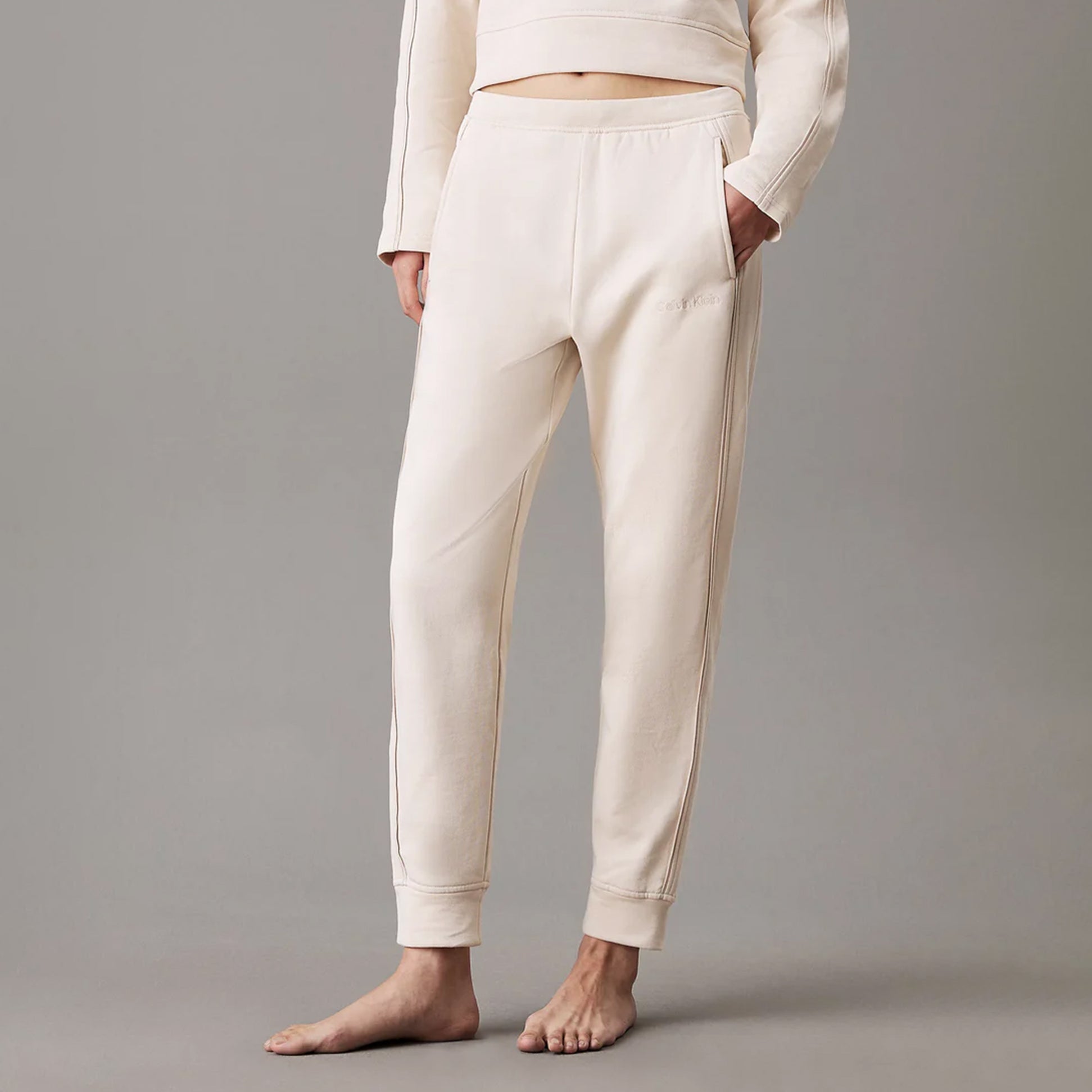 Calvin Klein TONAL LOGO LOUNGE Womens Joggers Sandshell front view showcasing soft cotton material and relaxed fit.
