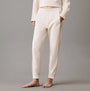 Calvin Klein TONAL LOGO LOUNGE Womens Joggers Sandshell front view showcasing soft cotton material and relaxed fit.