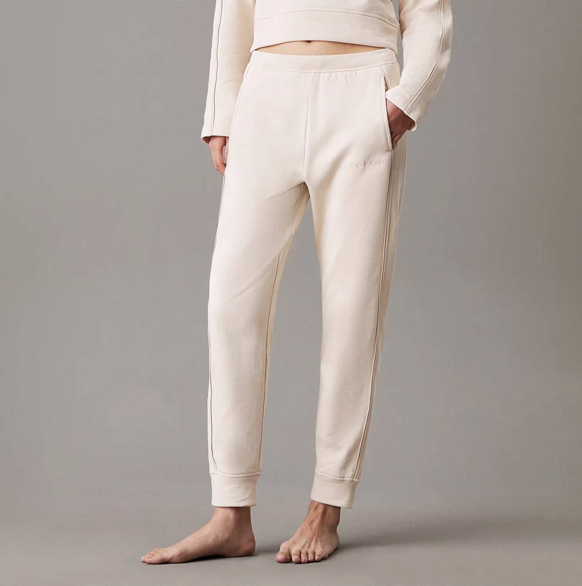 Calvin Klein TONAL LOGO LOUNGE Womens Joggers Sandshell front view showcasing soft cotton material and relaxed fit.