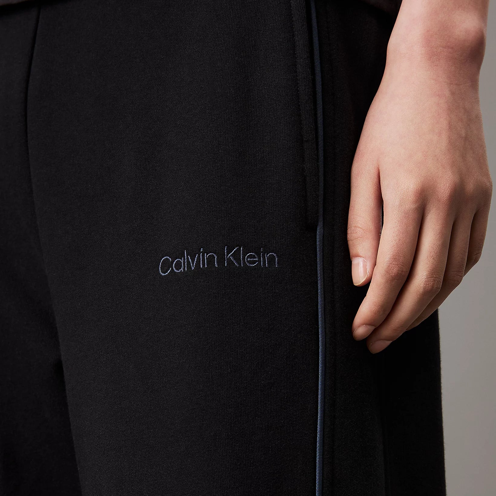 Calvin Klein TONAL LOGO LOUNGE Womens Joggers Black close-up detail view showcasing logo and fabric texture.