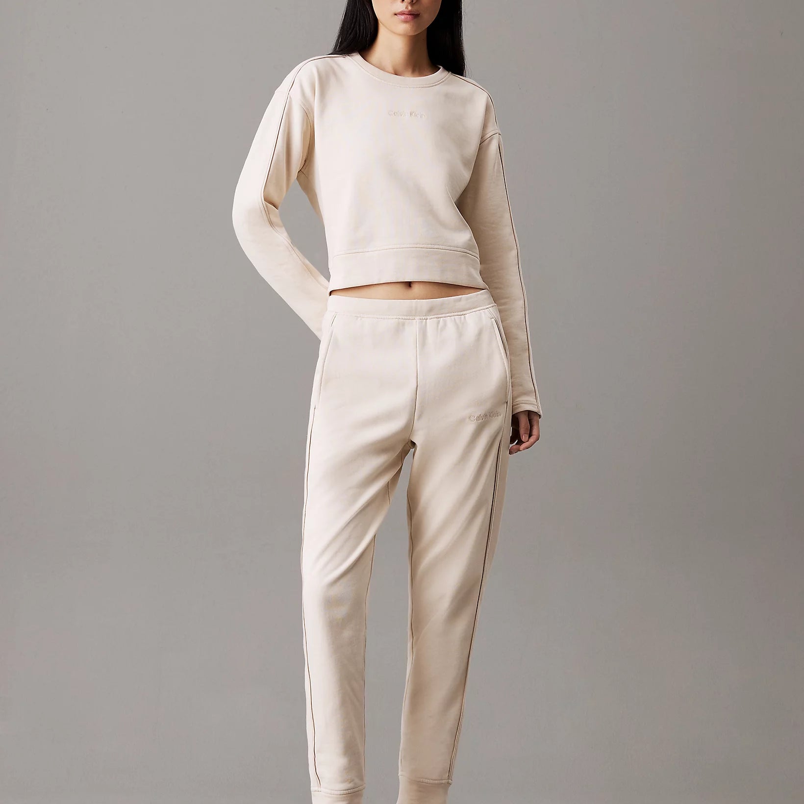 Calvin Klein COTTON FLEECE Womens Crew Pullover Sandshell front view on model with matching pants.