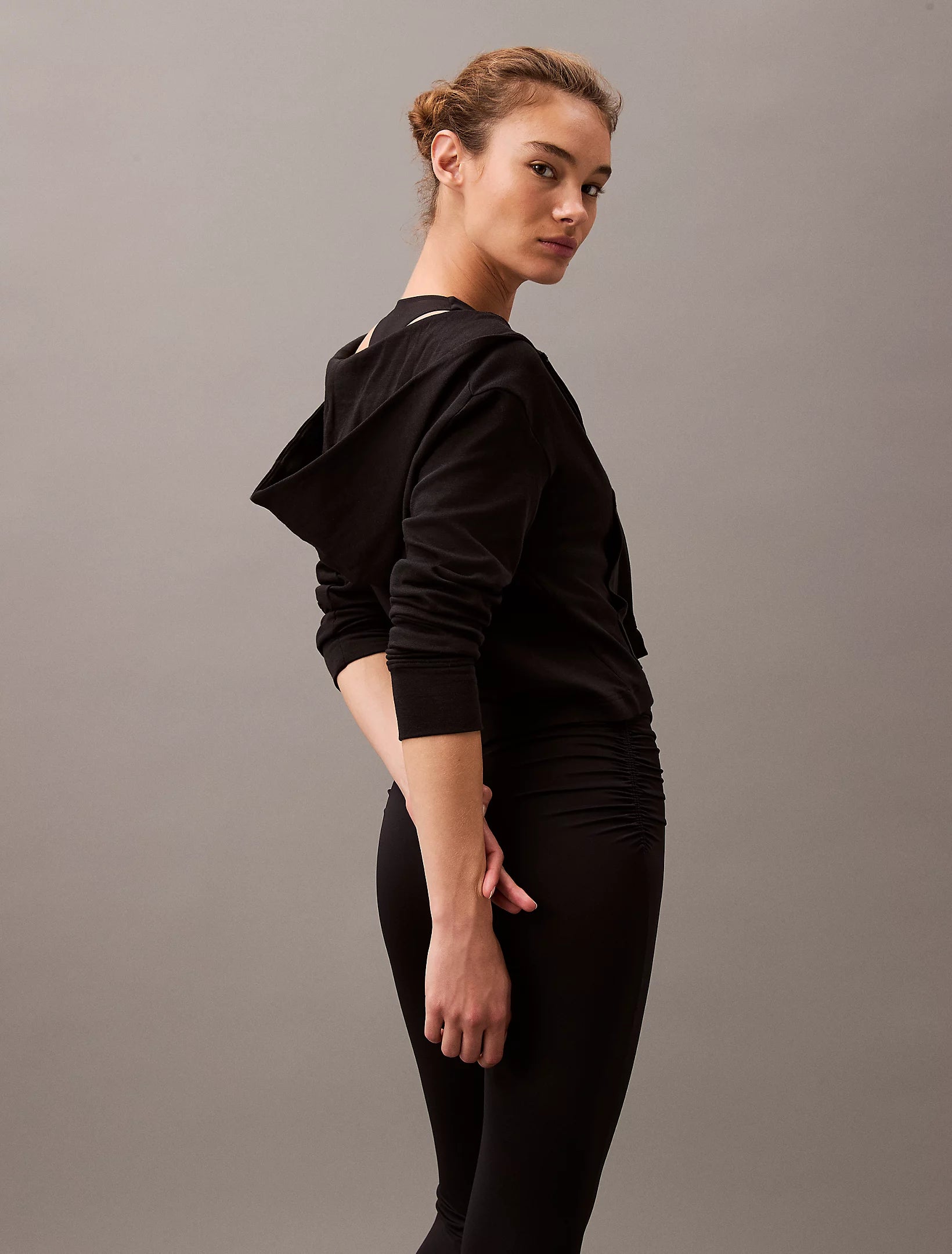 Calvin Klein MODERN TERRY Womens Full Zip Hoodie Black side view, showcasing the stylish hood and casual fit.