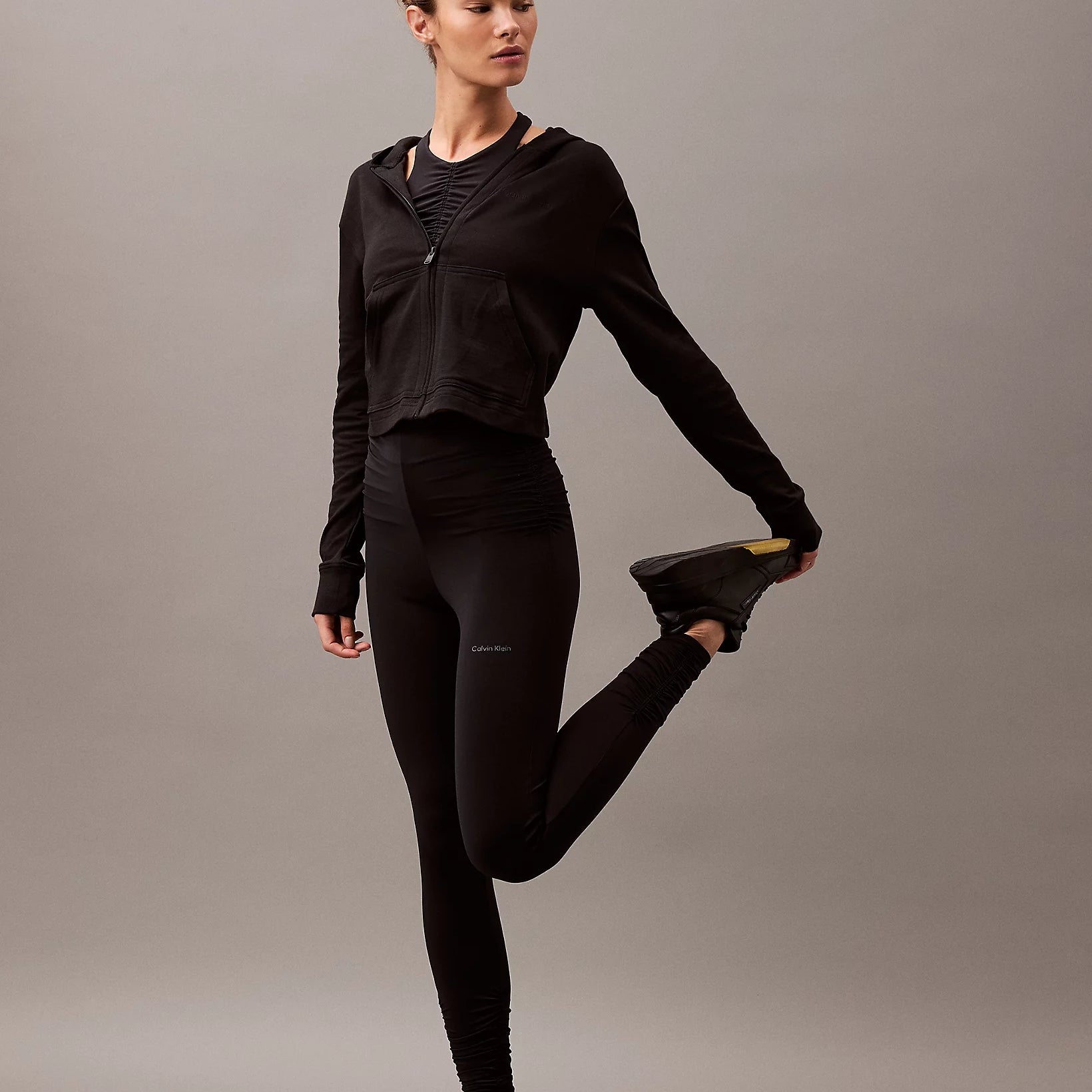 Calvin Klein MODERN TERRY Womens Full Zip Hoodie Black front view, model showcasing the stylish cropped hoodie.