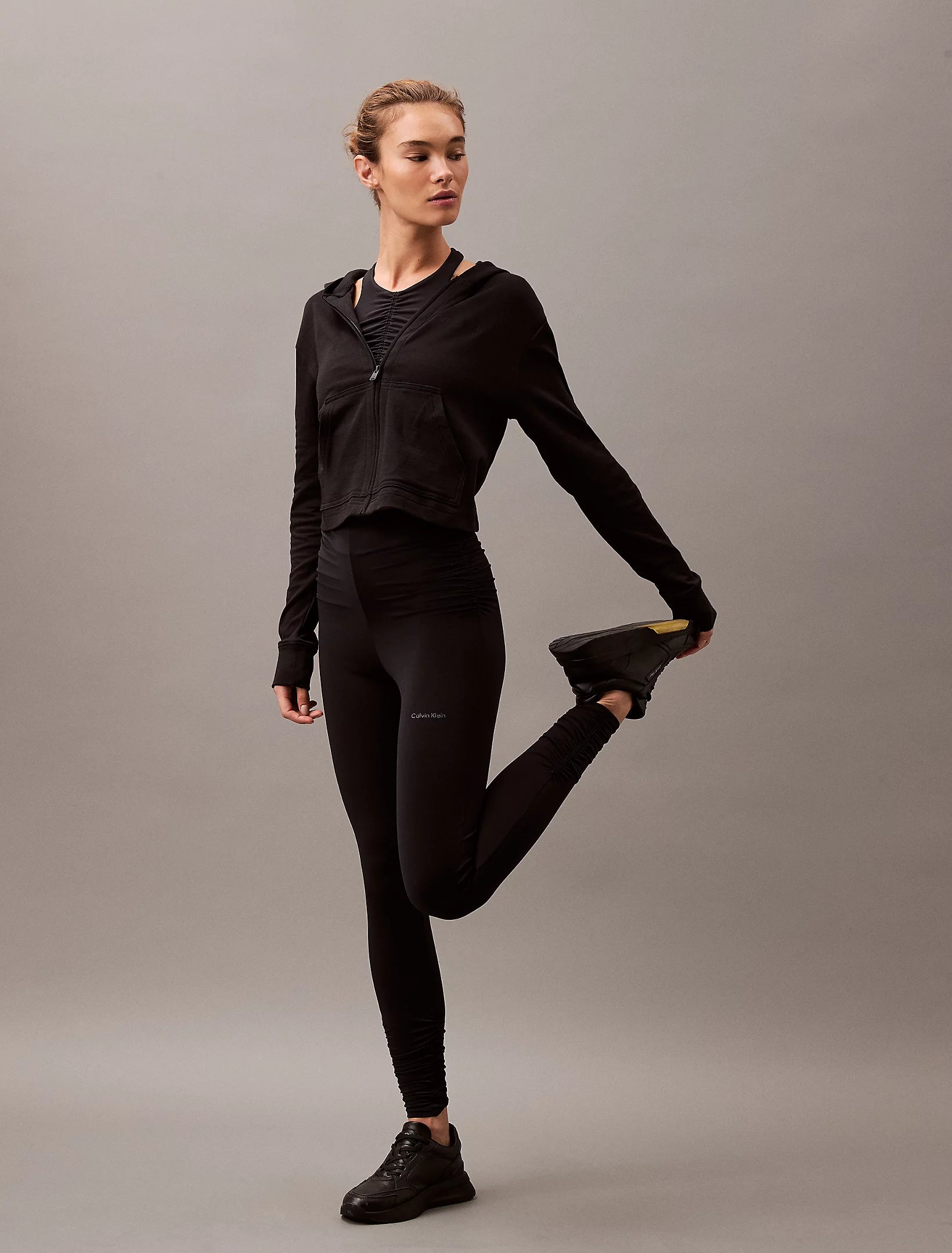 Calvin Klein MODERN TERRY Womens Full Zip Hoodie Black front view, model showcasing the stylish cropped hoodie.
