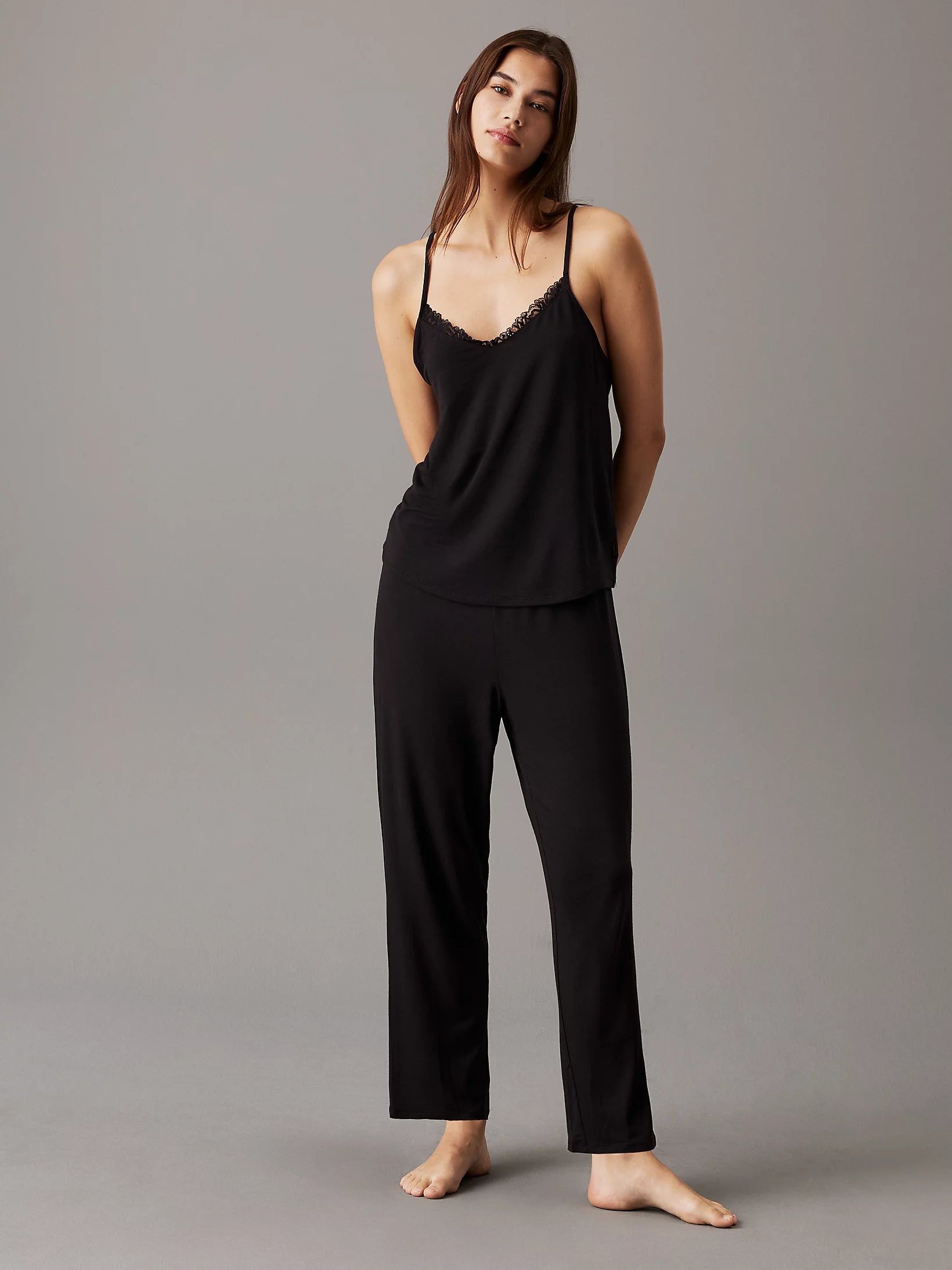 Calvin Klein CK ATTRACTION Womens Camisole Top Black front view on model, featuring scalloped lace trims and spaghetti straps.