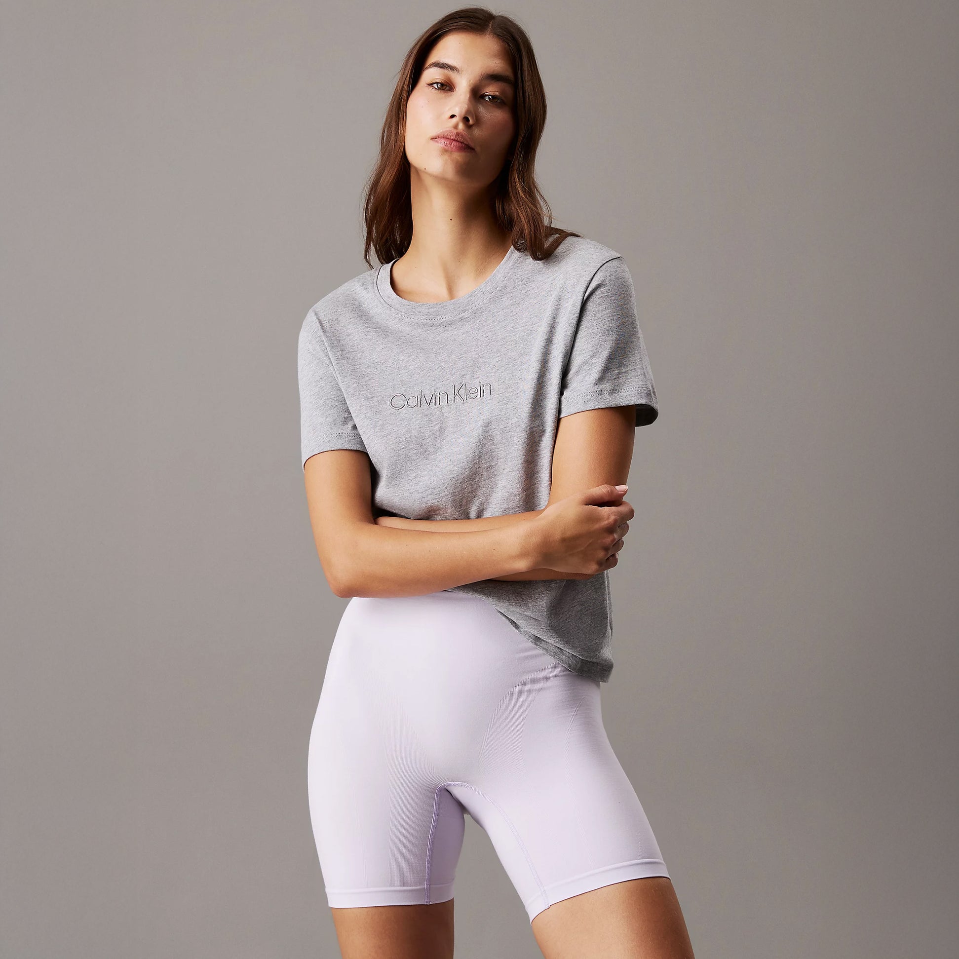 Calvin Klein Womens Lounge T-Shirt Grey Heather front view worn with bike shorts, showcasing comfort and casual style.