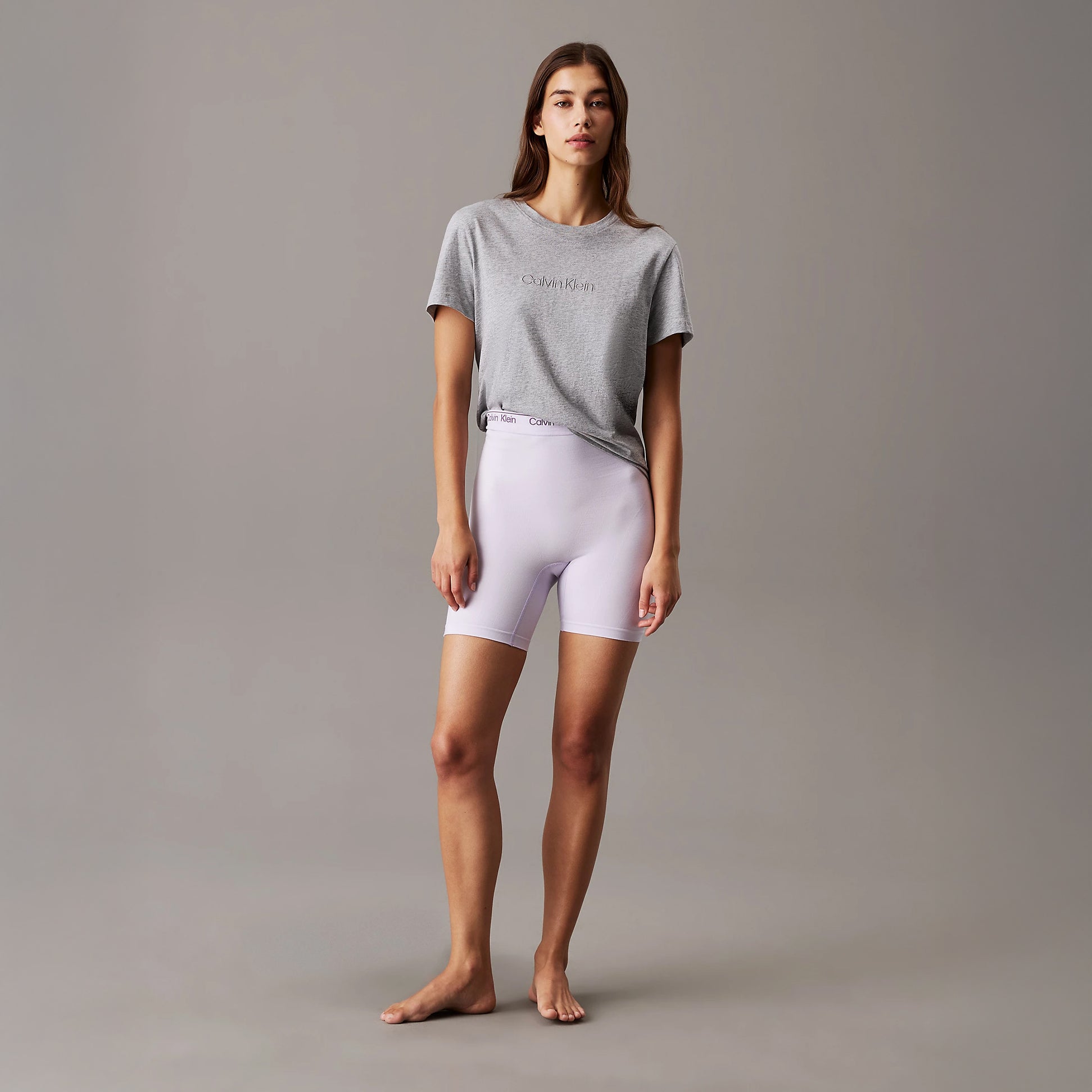 Calvin Klein Womens Lounge T-Shirt Grey Heather front view worn with lavender shorts, showcasing comfort and style.