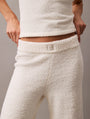 Calvin Klein PLUSH SWEATER Womens Pants Ivory close-up view showcasing soft texture and waistband detail.