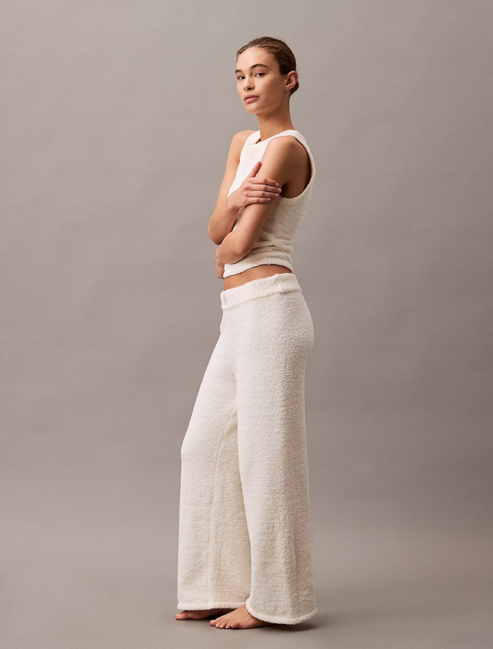 Calvin Klein PLUSH SWEATER Womens Pants Ivory side view featuring relaxed fit and soft texture, perfect for loungewear.