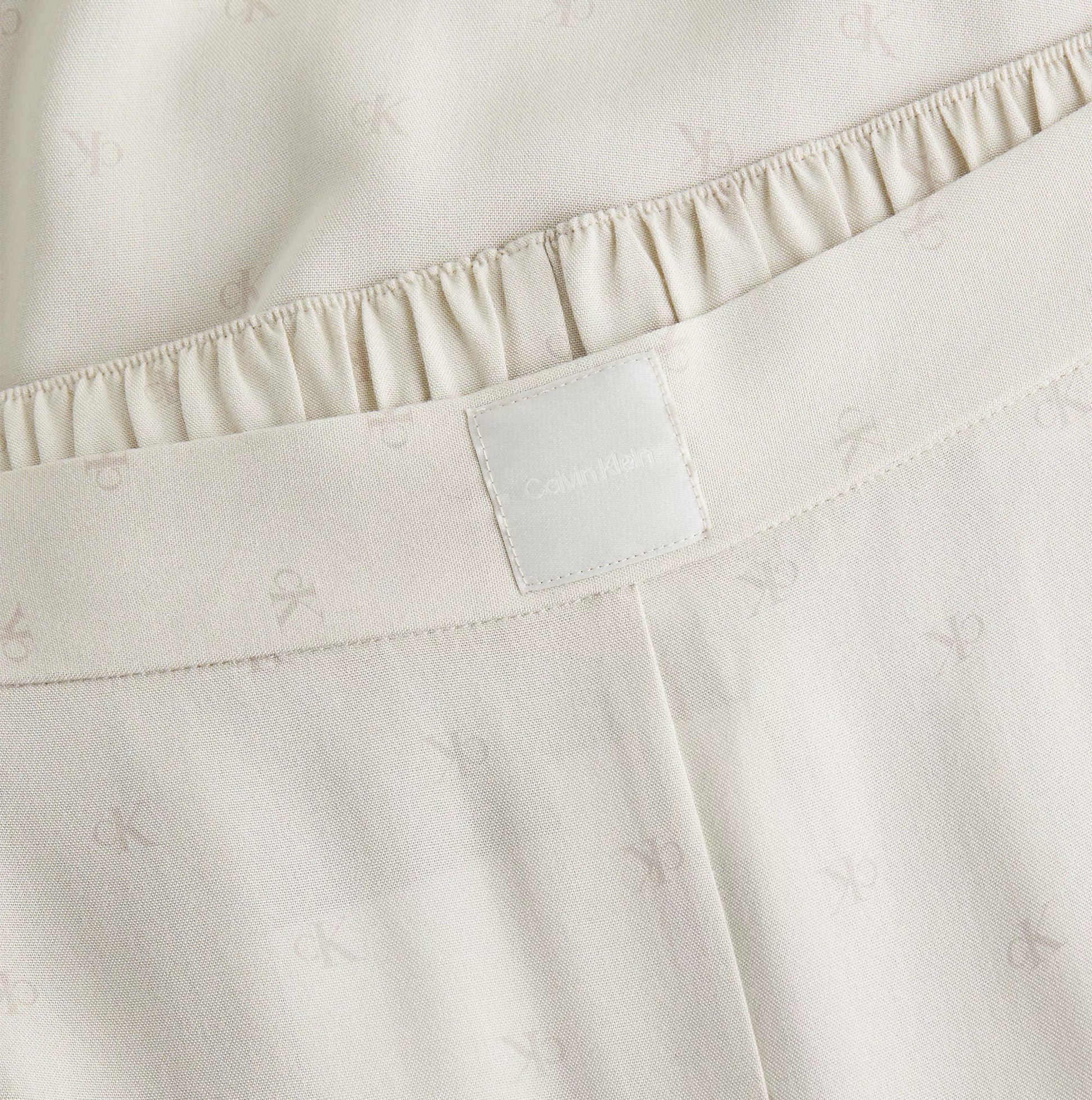 Calvin Klein WOVEN VISCOSE Womens Button Down Pants Set Diamond Logo/Cocoon close-up of waistband detail.