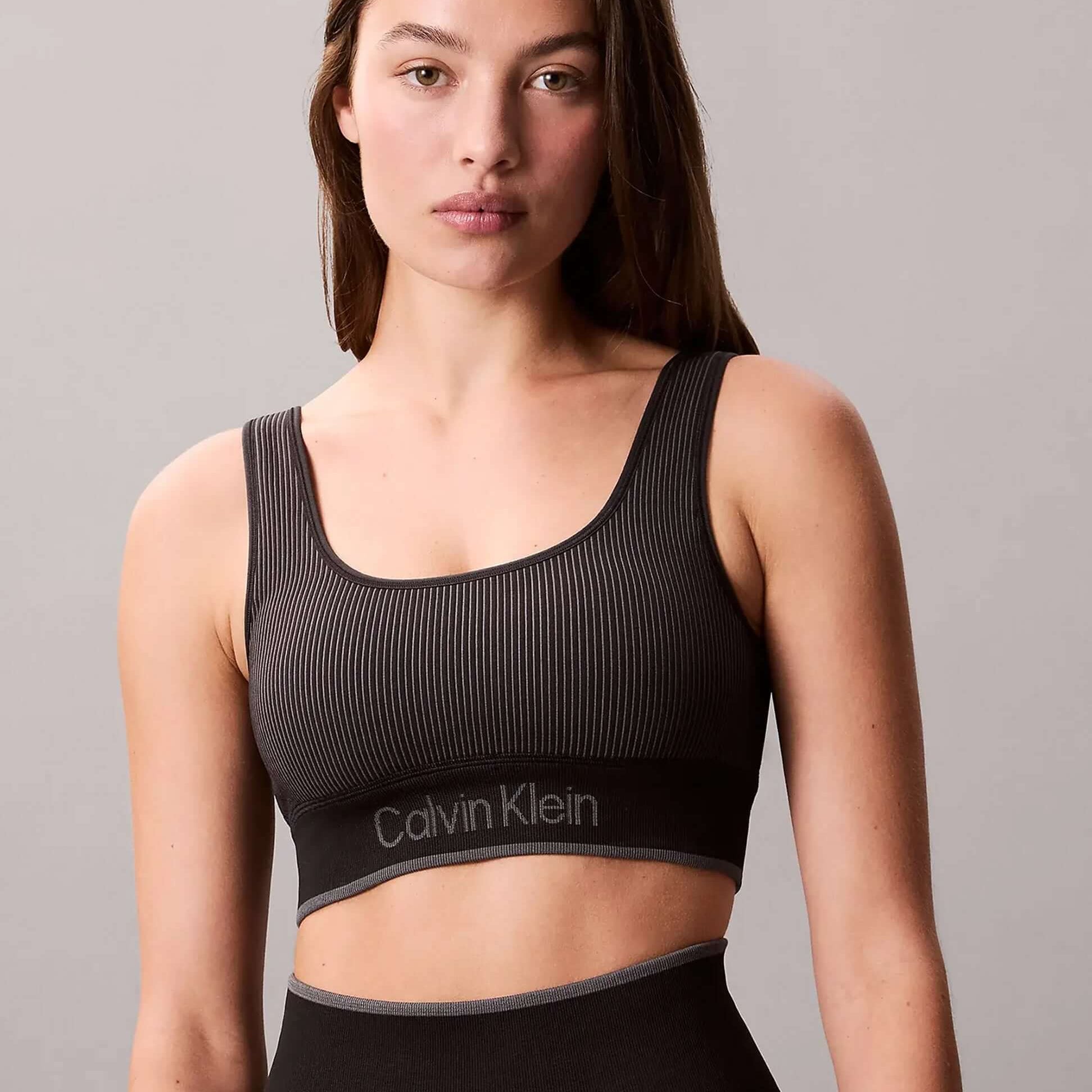 Calvin Klein Medium Impact Womens Sports Bra Black front view, showing ribbed design and logo at the band.