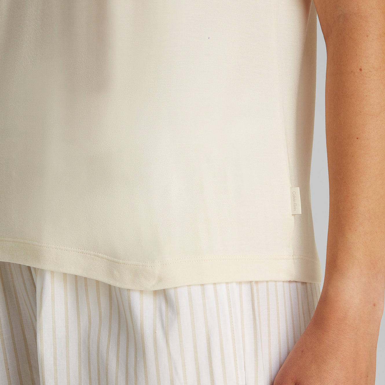 Calvin Klein ULTRA SOFT MODAL Womens Lounge T-Shirt Ivory side view showing short sleeves and crew neckline detail.