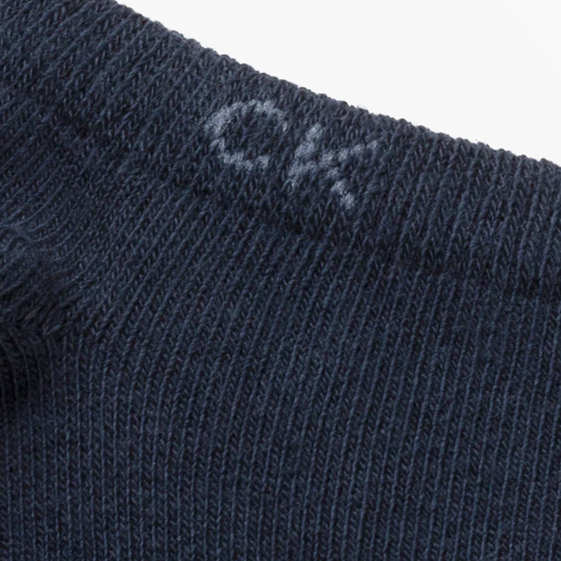 Calvin Klein 2 Pack Mens Ankle Trainer Socks Navy close-up detail view showing CK logo on sock.