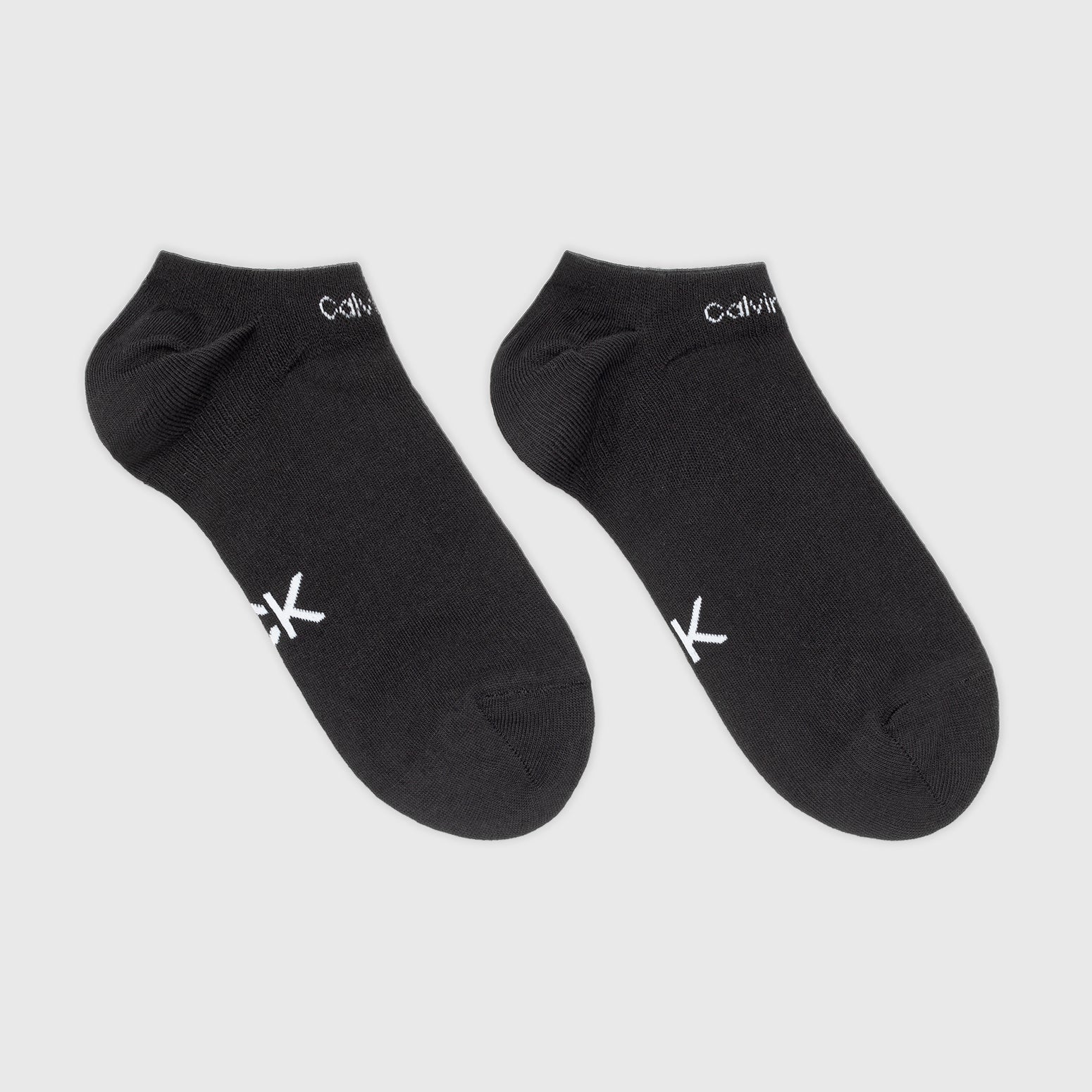Calvin Klein 2 Pack Womens Ankle Trainer Socks Black top view showcasing two pairs of black trainer socks with logo.