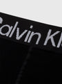 Calvin Klein LOGO Waist Leggings Black close-up view of waistband featuring CK logo in grey on black fabric.