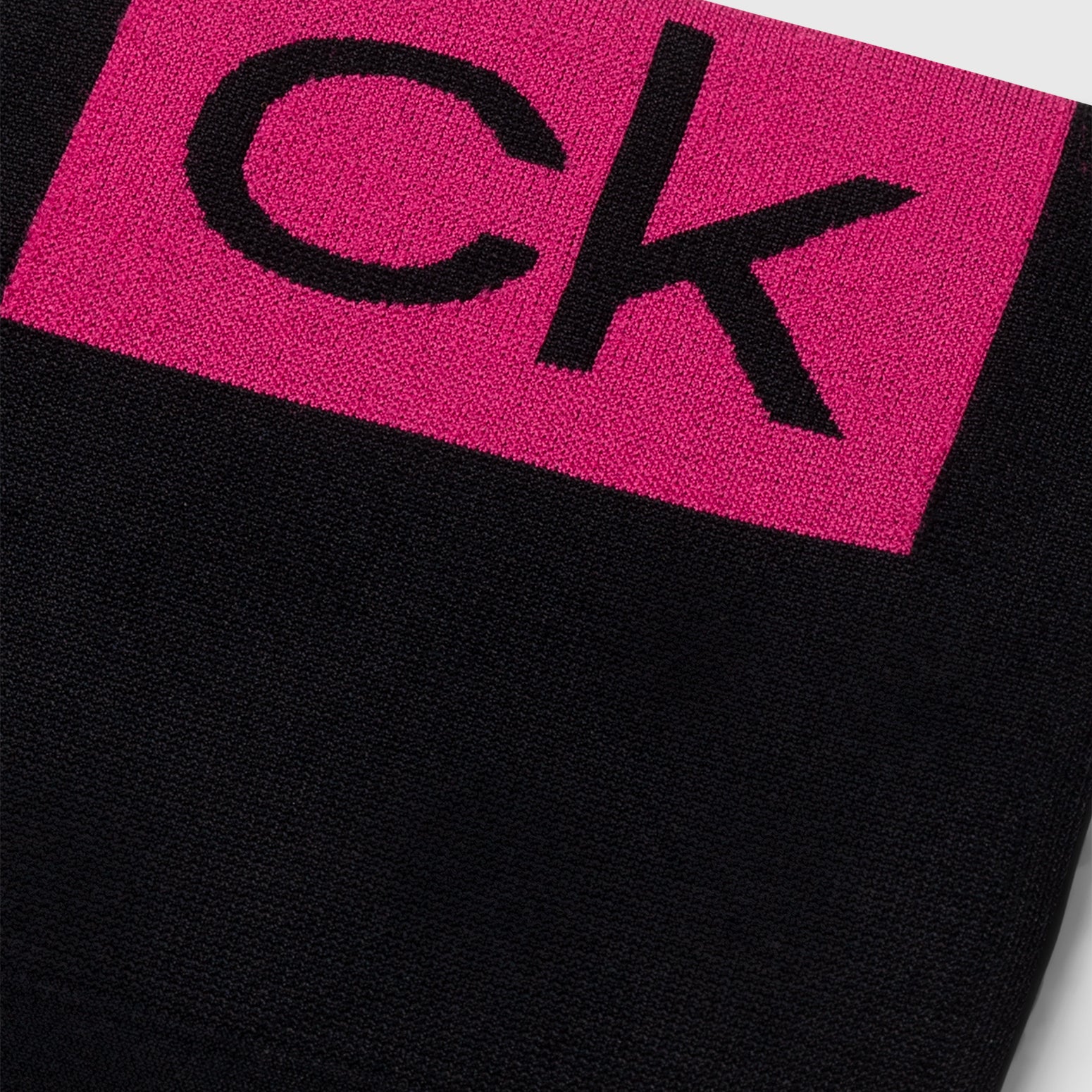 Calvin Klein LOGO Gym Leggings Black/Pink detail view of logo design on waistband.