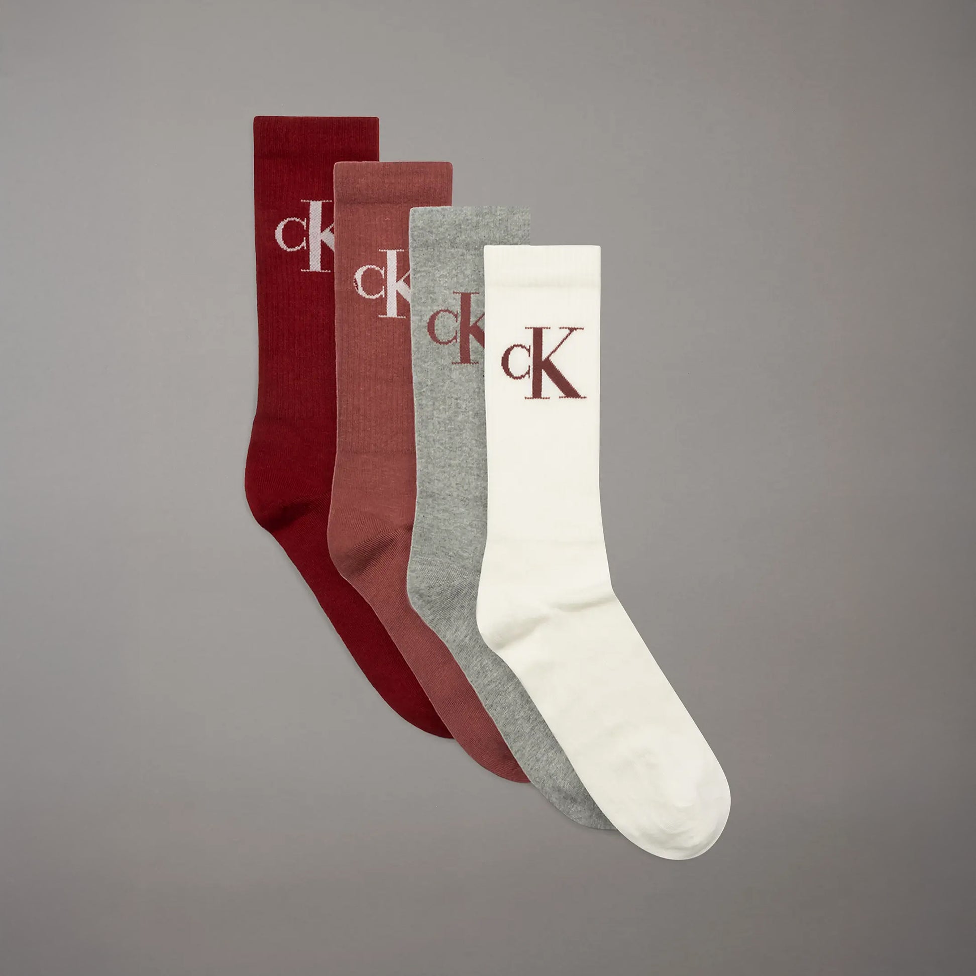 Calvin Klein 4 Pack Giftboxed Trainer Mens Crew Socks Red Combo side view showing four colors: red, grey, burgundy, cream.