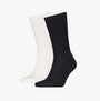 Calvin Klein 2 Pack Back Logo Mens Socks Black & White side view showing one black and one white sock with ribbed texture.