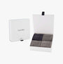 Calvin Klein 4 Pack Giftbox Classic Mens Socks Grey Combo in open gift box showcasing four pairs of grey socks.