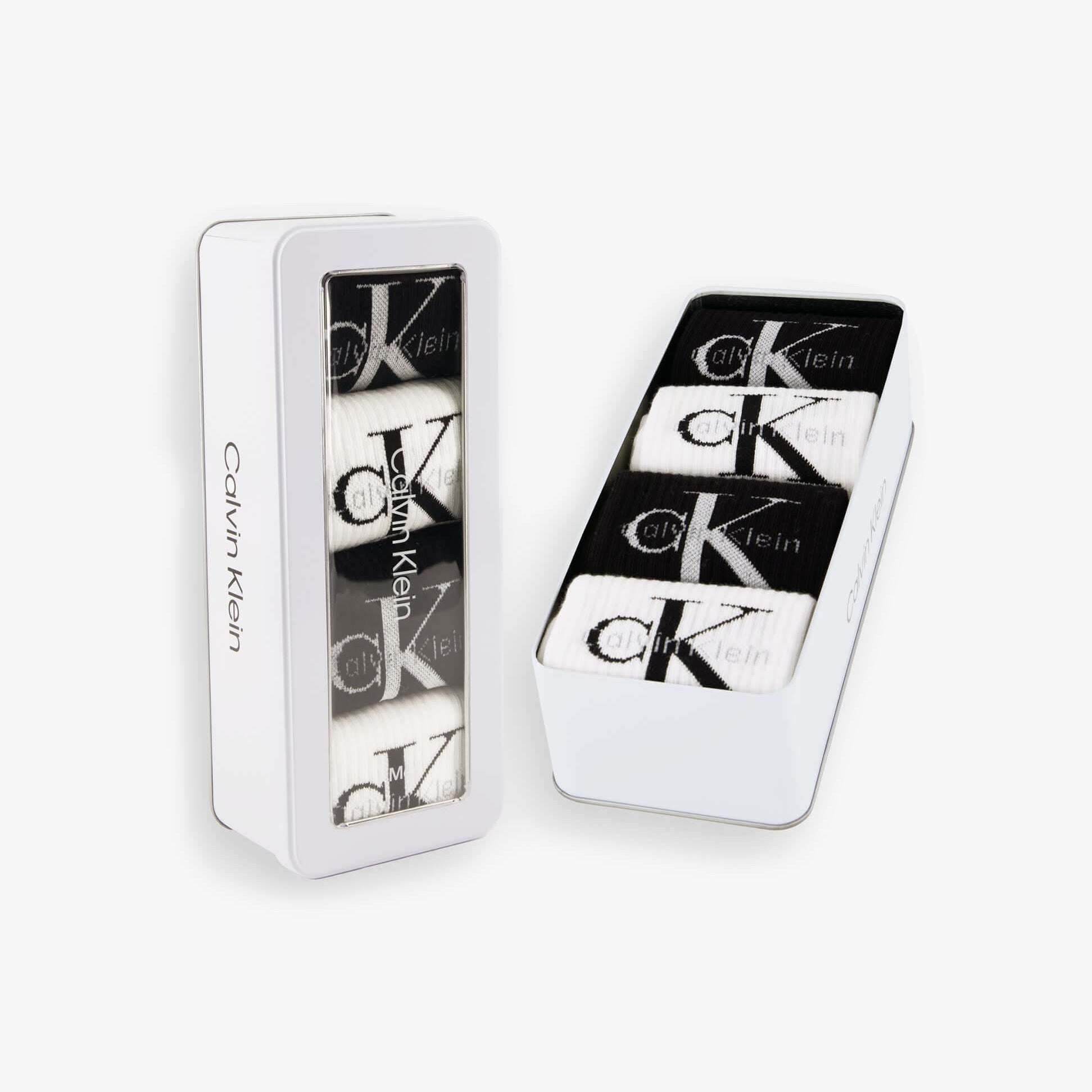 Calvin Klein 4 Pack Giftbox Monologue Mens Socks White/Black shown in white gift box with socks visible from front view.