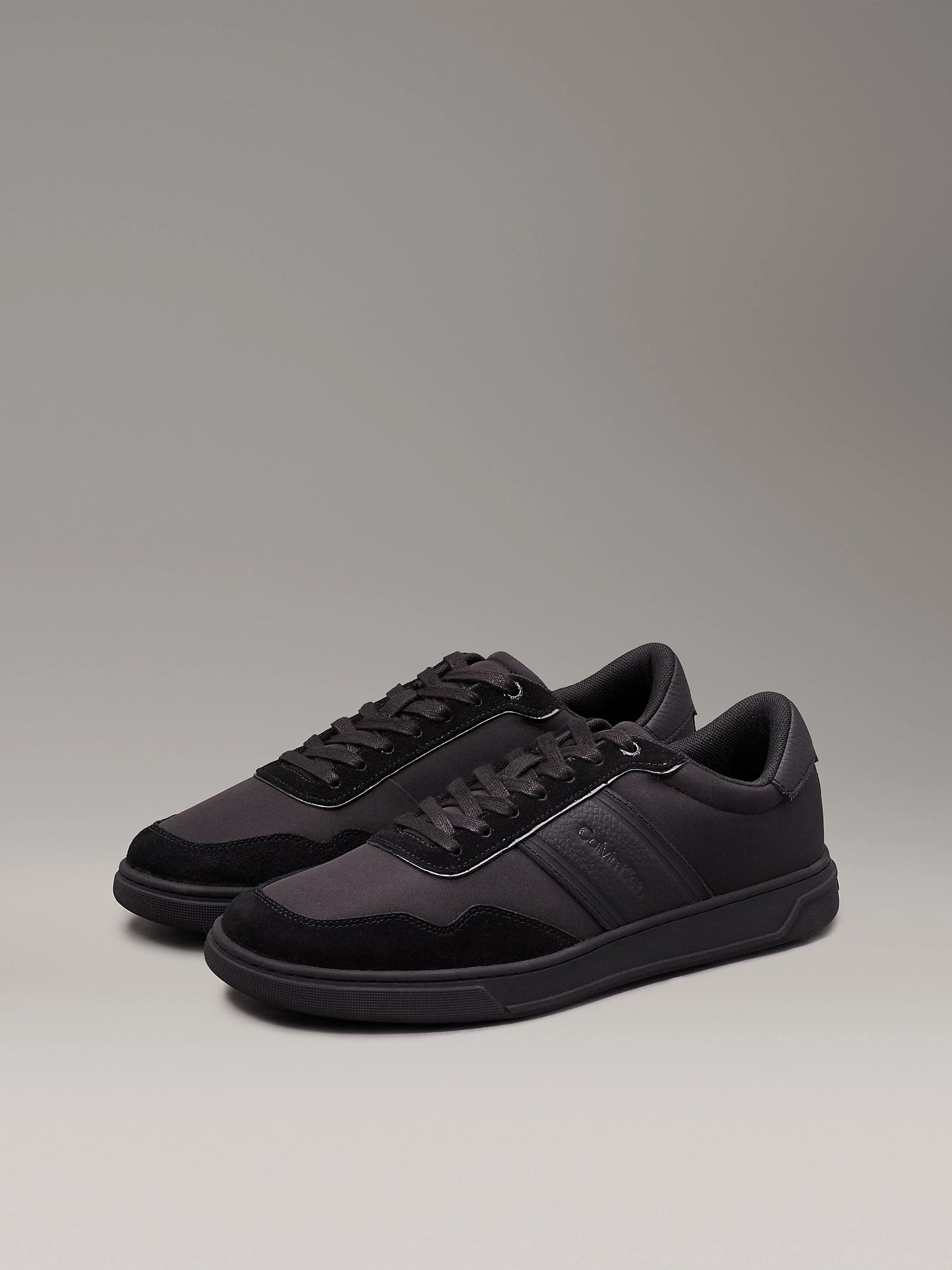 Calvin Klein LOW TOP LACE UP MIX Mens Trainers Triple Black side view featuring casual lace-up design, round toe, and low top.