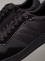 Calvin Klein LOW TOP LACE UP MIX Mens Trainers Triple Black close-up detail view showcasing black laces and material.