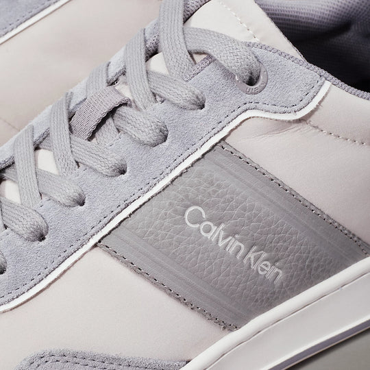 Calvin Klein LOW TOP LACE UP MIX Mens Trainers Light Grey/Granite Road detail view of shoe upper with laces and logo.