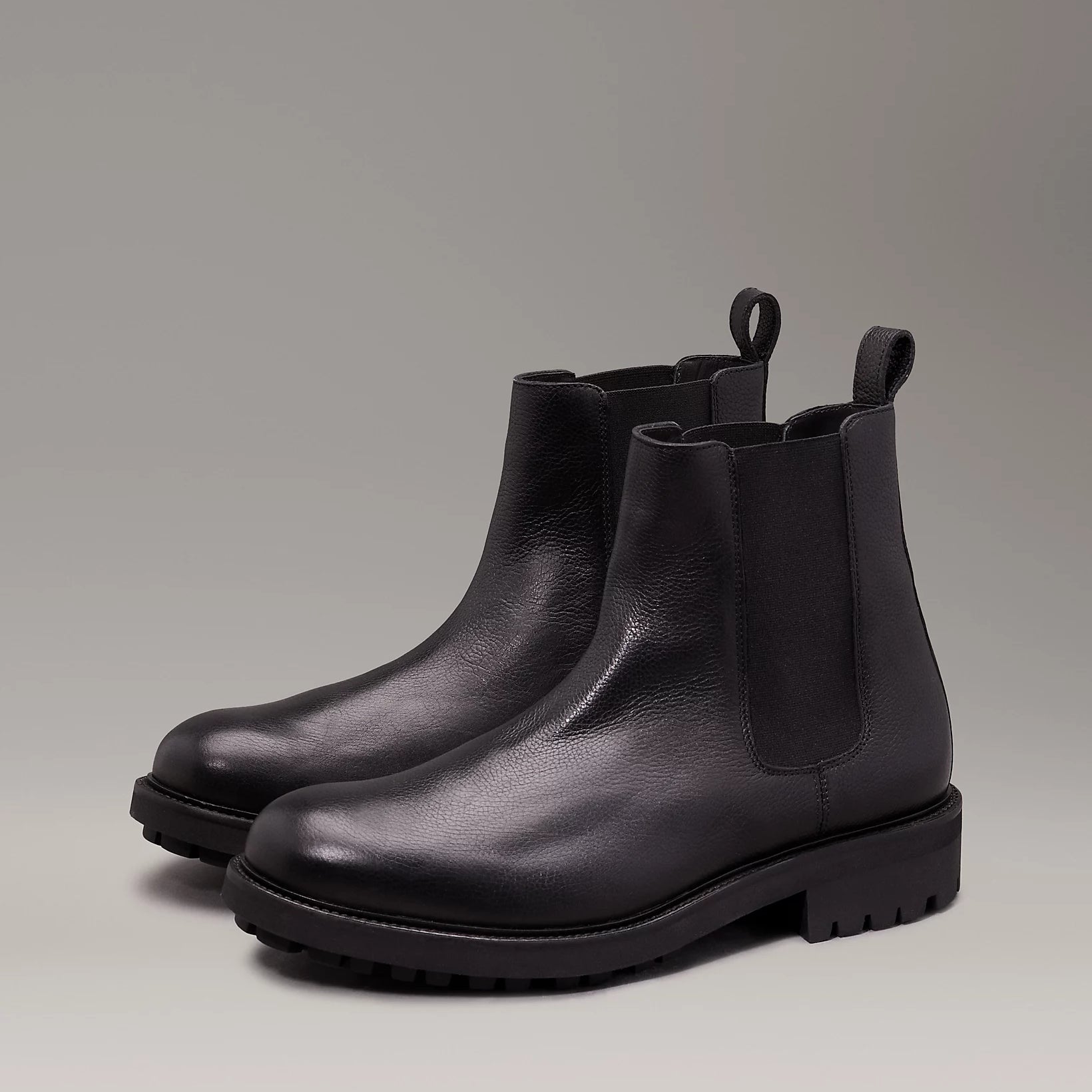 Calvin Klein CHELSEA BOOTS Mens Ck Black side view showing leather upper and block heel for comfort.