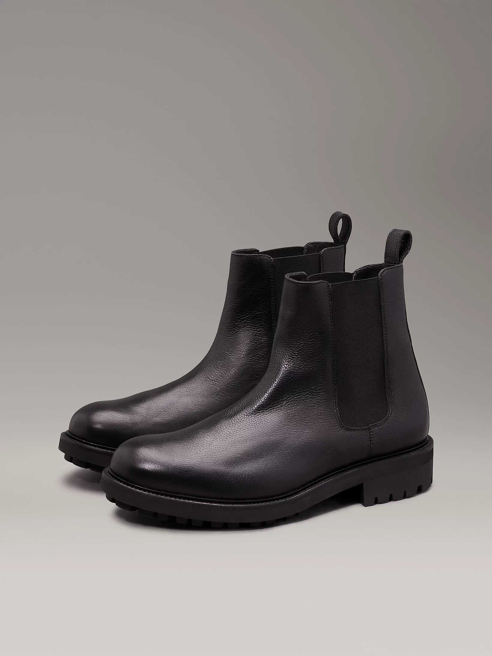Calvin Klein CHELSEA BOOTS Mens Ck Black side view showing leather upper and block heel for comfort.
