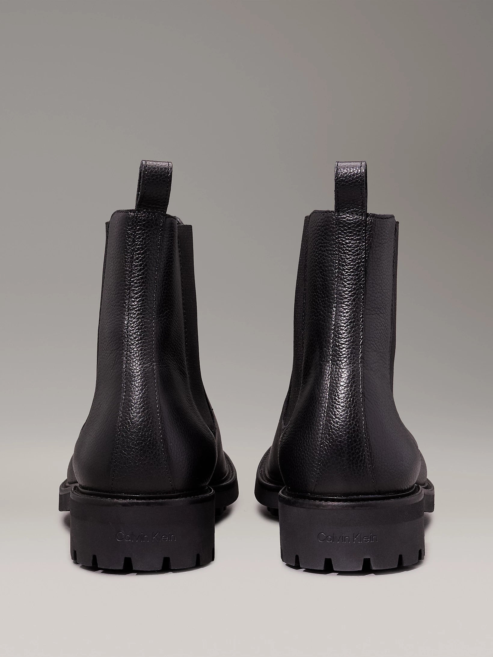 Calvin Klein CHELSEA BOOTS Mens Ck Black rear view showcasing sleek leather design and block heel.