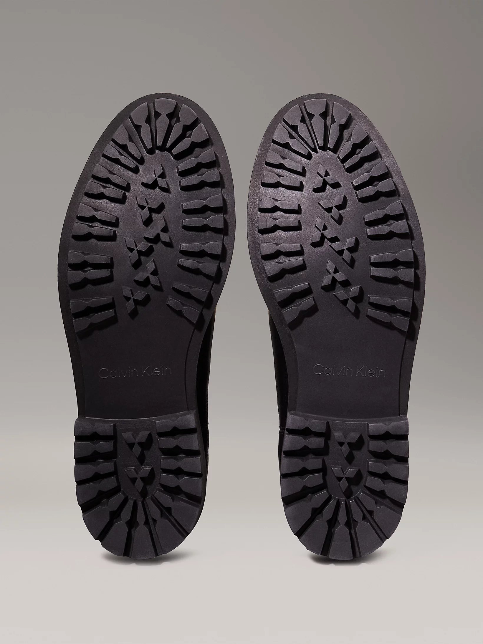 Calvin Klein CHELSEA BOOTS Mens Ck Black sole view, featuring a rubber tread design for traction and durability.