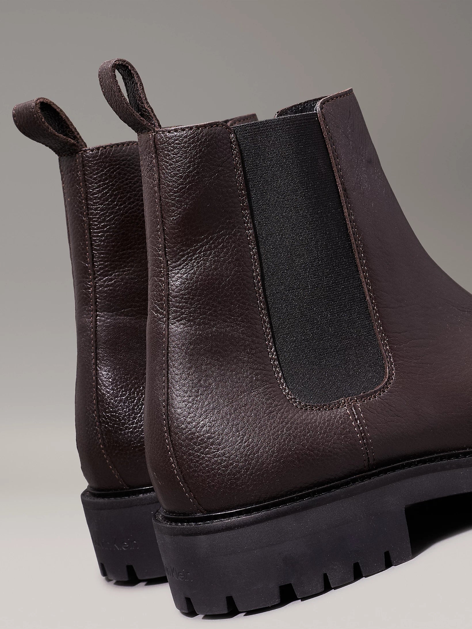Calvin Klein CHELSEA BOOTS Mens Mole, rear view showing brown leather upper and elasticated side panel.