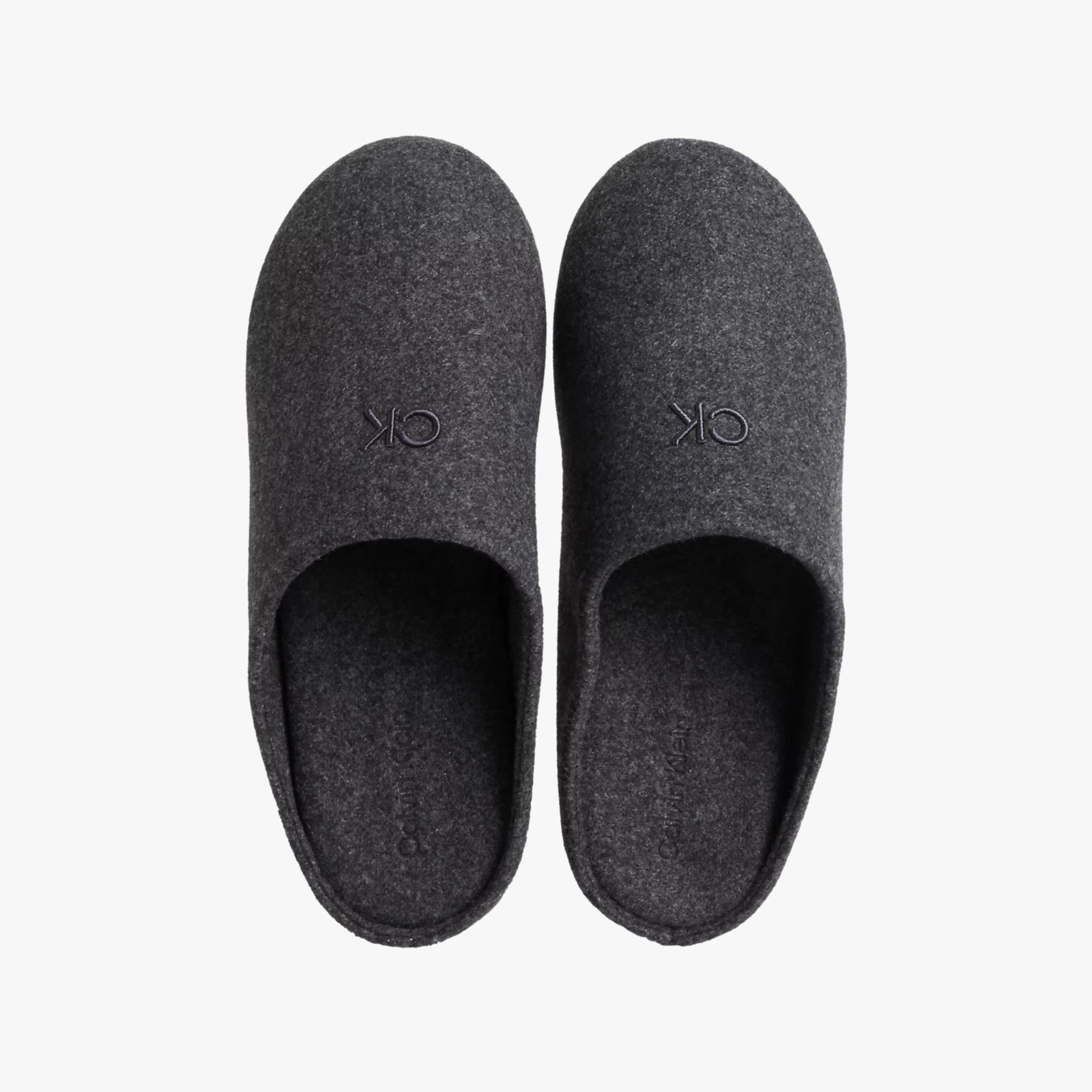 Calvin Klein MULE Mens Mule Slippers Ck Black top view showing dark gray slip-on style with round toe design.