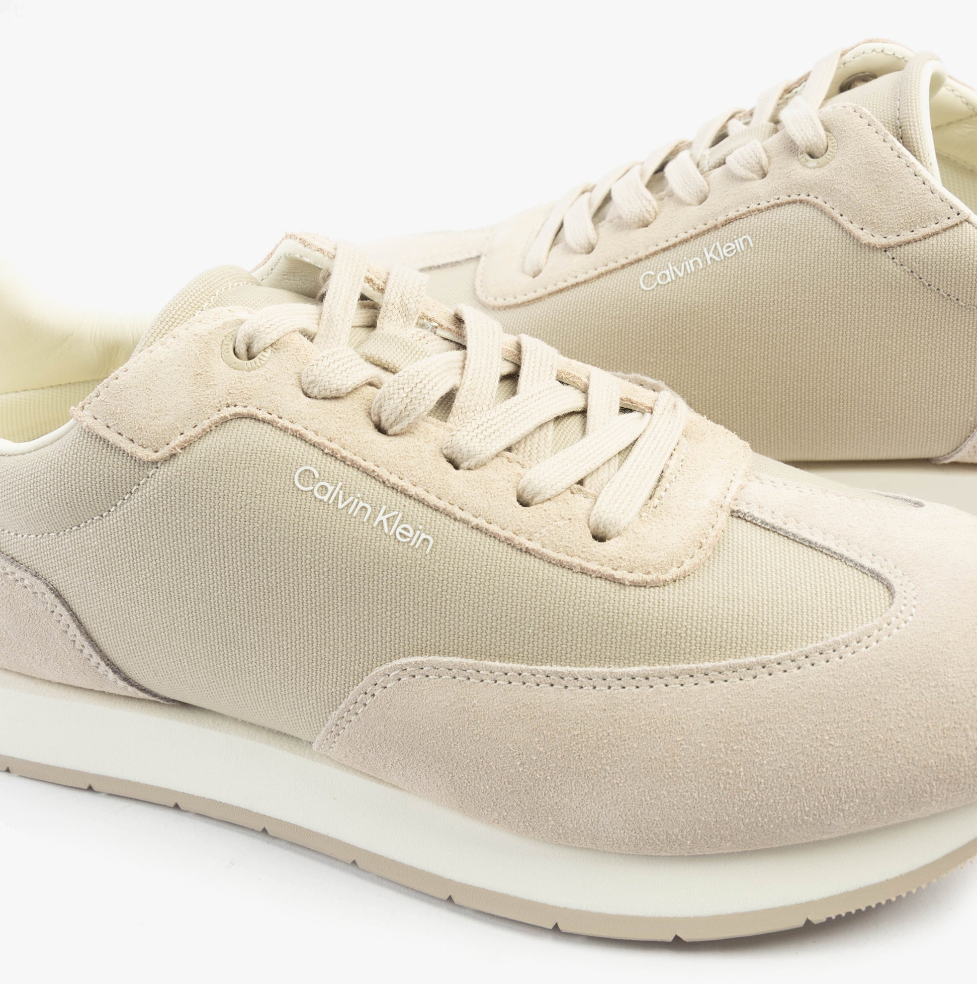 Calvin Klein SUEDE LOW PROFILE Mens Trainers Feather Gray Mix side view showcasing suede and leather upper in beige.