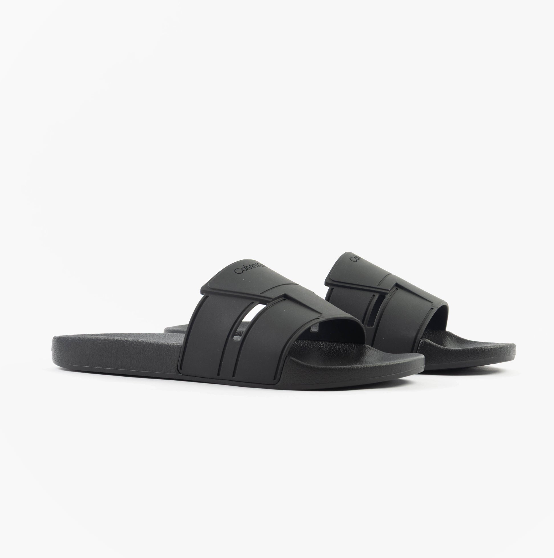 Calvin Klein POOL SLIDE DOUBLE T Mens Sliders Ck Black side view showcasing the synthetic upper and rubber sole.