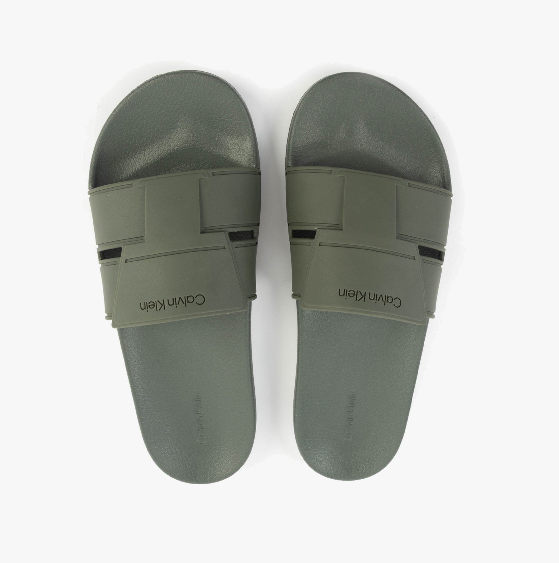Calvin Klein POOL SLIDE DOUBLE T Mens Sliders Dark Olive top view showcasing lightweight synthetic design and slip-on closure.