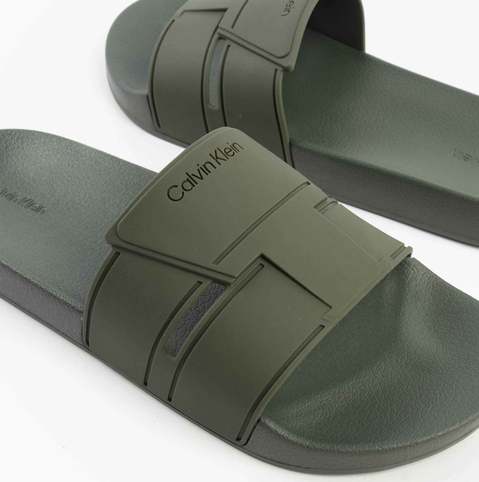Calvin Klein POOL SLIDE DOUBLE T Mens Sliders Dark Olive side view of sliders with synthetic upper and rubber sole.